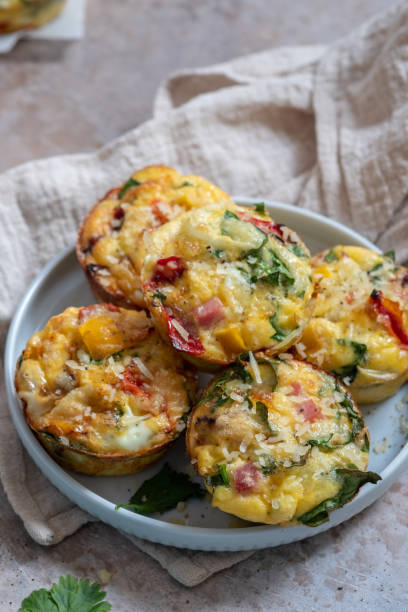 istock Delicious egg muffins with ham, cheese and vegetables 1269399780