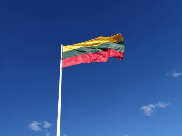 istock Lithuania flag in front of blue sky 1269402225