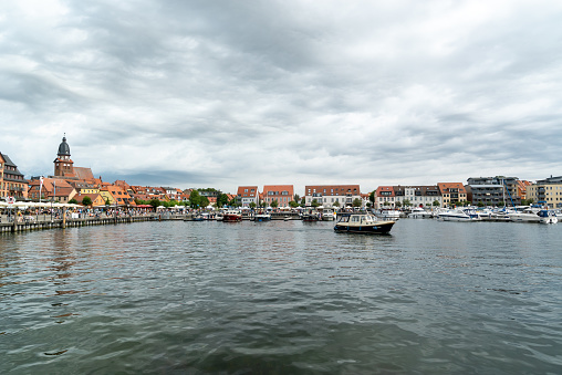 Waren, M-V / Germany - 22 August 2020: the harbor and old town of Waren on Lake Mueritz in Germany