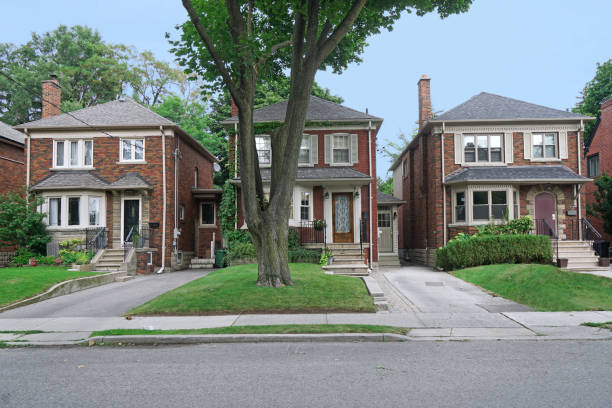 istock Street of modest middle class two story brick homes 1269413952