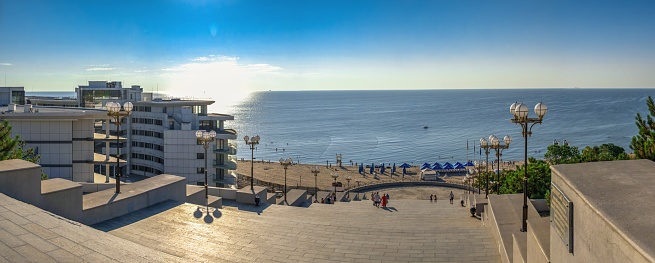 Chernomorsk, Ukraine 08.22.2020. Maritime Stairs from seaside park to the public beach in Chernomorsk city on a sunny summer morning