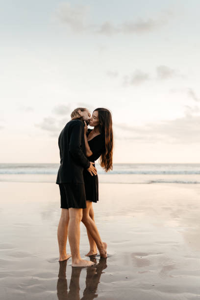 istock Attractive man and woman enjoying romantic evening on sunset 1269444218