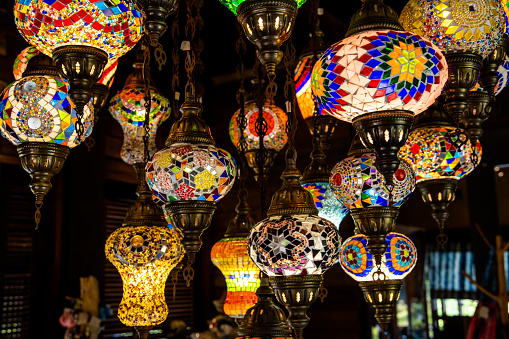 Turkish style stained glass electric lamps/chandelier hanging in a living room for decoration.