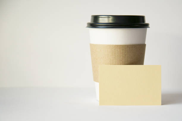 istock empty cardboard coffee Cup and an empty business card 1269445545