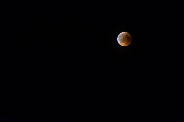 istock partly obscure moon during a lunar eclipse at the top right 1269448305