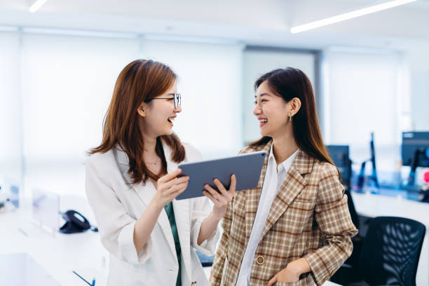 istock Two Businesswomen working together in office. 1269449442