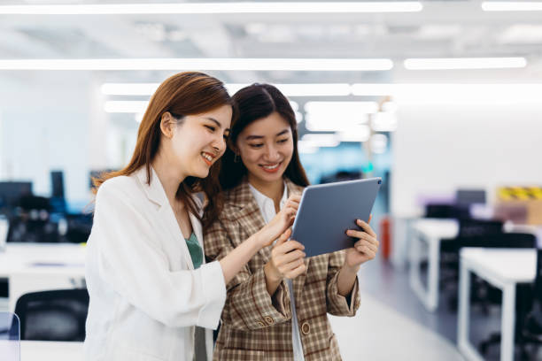 istock Two Businesswomen working together in office. 1269449454