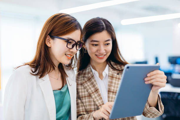 istock Two Businesswomen working together in office. 1269449456