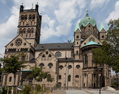 South side of St. Quirin Minster in Romanesque Gothic transitional style with Baroque hood of the crossing tower.