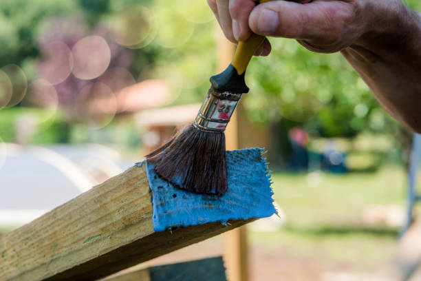 istock man making a wooden garden fence 1269456031