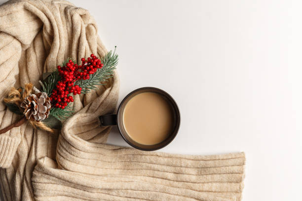 istock Abstract autumn composition. Colorful background image. Autumn, winter concept. Top view. Flat lay. Copy space. Plaid, dried leaves, cup of coffee on white background. Thanksgiving day concept 1269456063