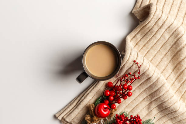 istock Abstract autumn composition. Colorful background image. Autumn, winter concept. Top view. Flat lay. Copy space. Plaid, dried leaves, cup of coffee on white background. Thanksgiving day concept 1269456875