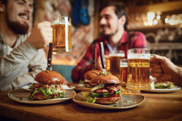 istock Burger with beer on the table in a bar pub. 1269457903