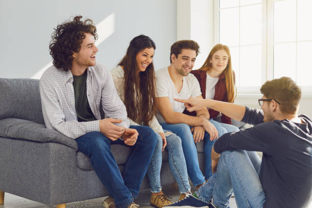istock A group of friends talking in a room. 1269458045