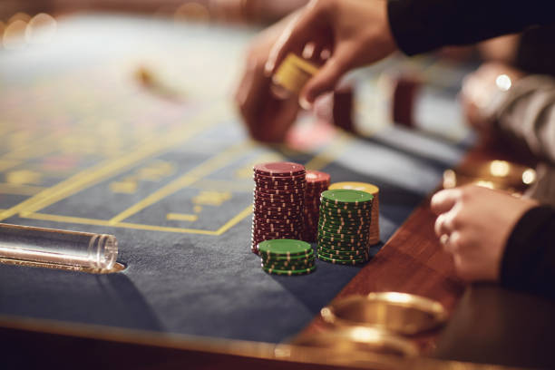 istock Hands of people at the roulette table table. 1269459071