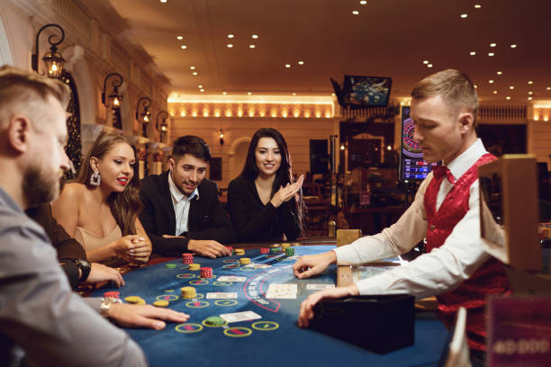 istock People gamble at a poker table in a casino 1269459088