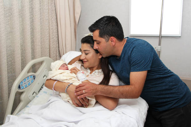 istock Newborn baby with parents 1269460351