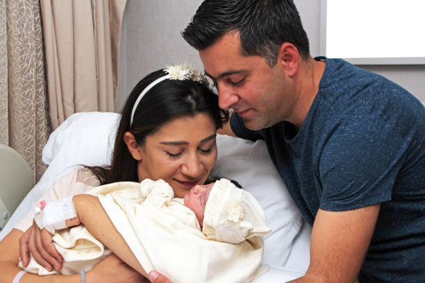 istock Newborn baby with parents 1269460384