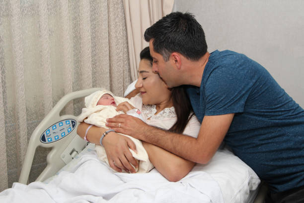 istock Newborn baby with parents 1269460401