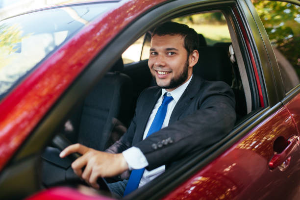 istock Handsome young man driving a car in summer. 1269462843