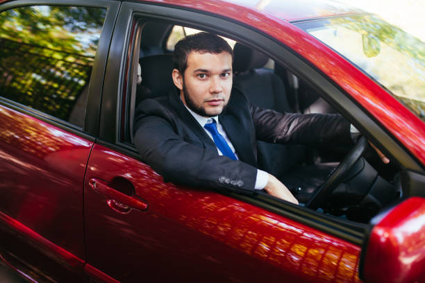 istock Handsome young man driving a car in summer. 1269463598