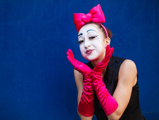 istock Mime portrait near a blue wall. Isolated on blue background 1269463917