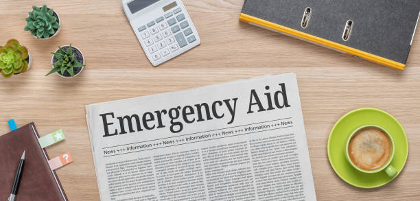 istock A newspaper on a desk with the headline Emergency Aid 1269465082