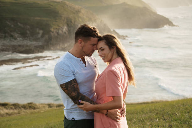 istock Young couple spending time together by the sea 1269466134