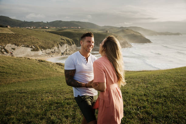 istock Young couple spending time together by the sea 1269467299