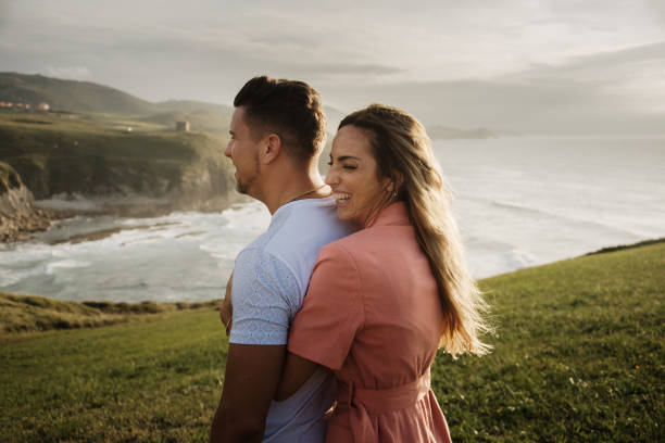istock Young couple spending time together by the sea 1269468531