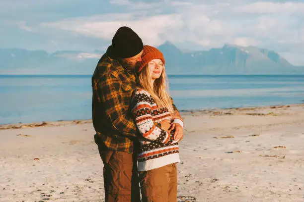 Photo of Hugging couple on beach traveling together man and woman family lifestyle concept romantic vacations outdoor