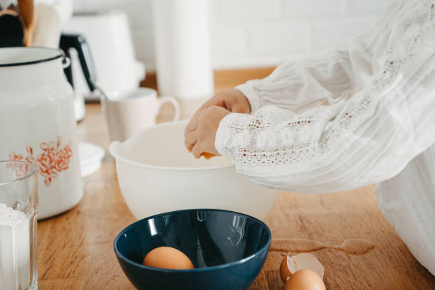 istock Little girl preparing dough for pancakes at the kitchen. 1269468769