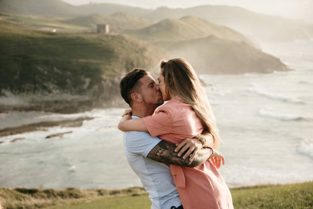 istock Young couple spending time together by the sea 1269469480