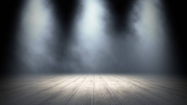 istock Empty stand up scene with wooden floor and spot lights.. Empty room studio gradient used for background and display your product. 3d illustration 1269469941