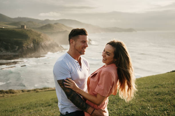 istock Young couple spending time together by the sea 1269471533