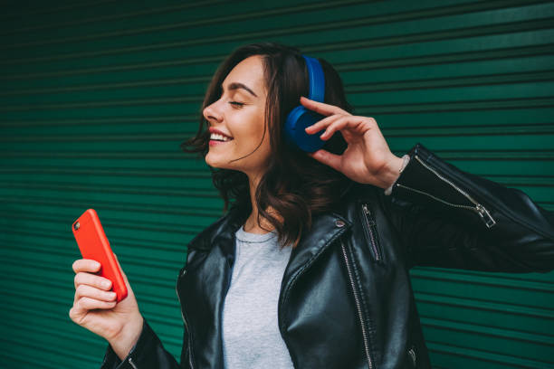 istock Millennial girl enjoying disco music 1269475935