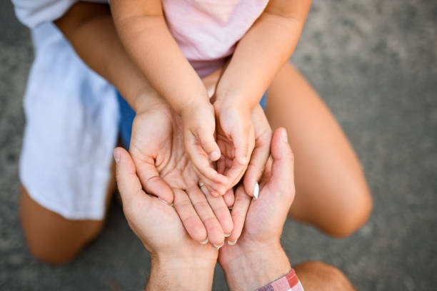 istock top view on hands which turned palms up and lie on each other 1269476494