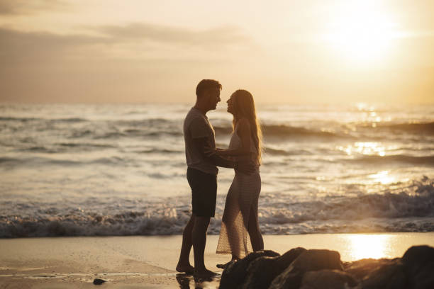 istock Young couple spending time together by the sea 1269478523