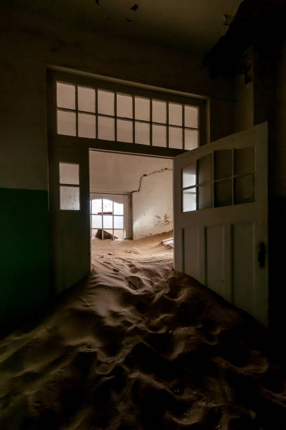 istock Decaying architecture at Kolmanskop, an abandoned diamond mining town 1269479734