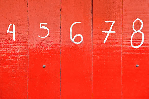 istock White numbers on red painted wooden panels 1269487322