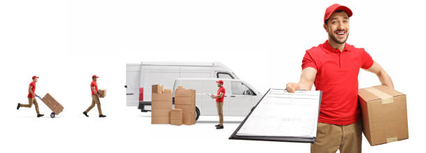 istock Courier with a box and a clipboard and other workers loading boxes in vans 1269487687