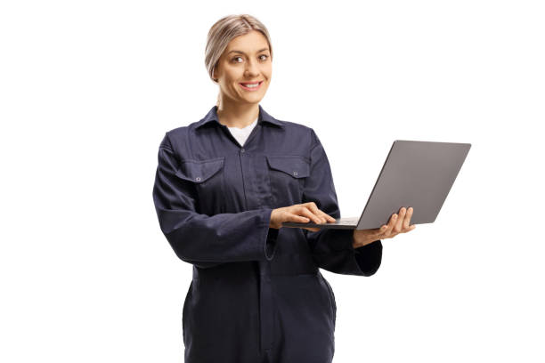 istock Female worker in a navy blue overall uniform with a laptop computer 1269487895