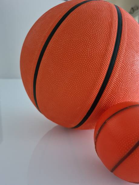istock Two basketballs small and big 1269488872