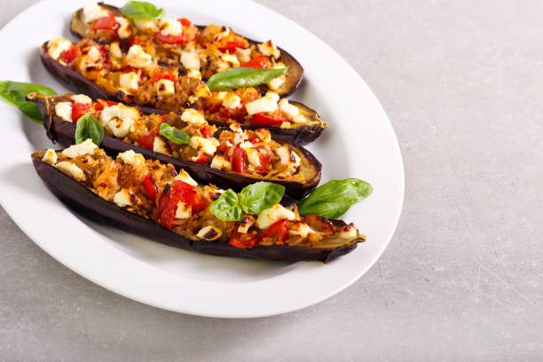 istock Stuffed eggplants halves, baked and served 1269489818