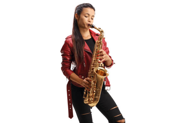 istock Young female saxophonist in a red leather jacket playing sax 1269490025
