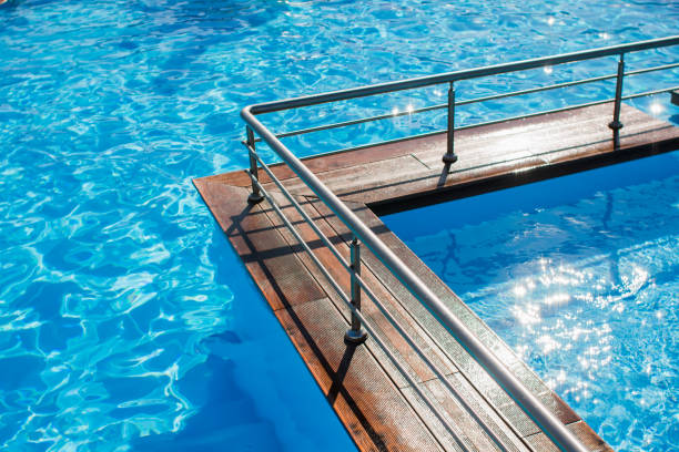 istock swimming pool in a complex with blue water 1269490947
