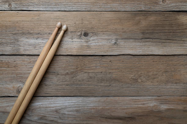istock Drum stick on wooden table background, top view, music concept 1269491110