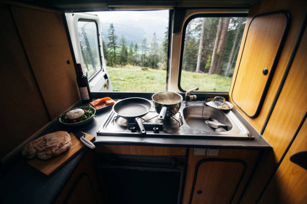 Interior of camper van with kitchen and view stock photo