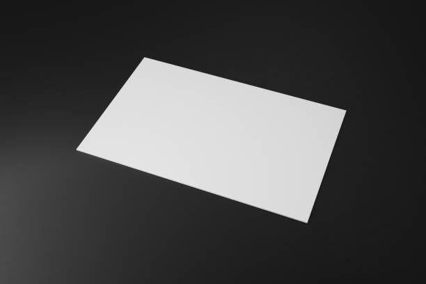 istock White horizontal business card paper mockup template with blank space cover for insert company logo or personal identity on black cardboard background. Modern concept. 3D illustration render 1269493575