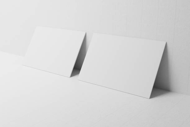 istock White business card paper mockup lean on wall template with blank space cover for insert company logo or personal identity on cardboard background. Modern stationary concept. 3D illustration render 1269493667